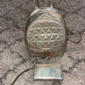 Michael Kors metallic gold backpack and wristlet/wallet.